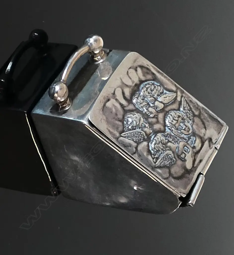 Miniature Silver Coal Scuttle Stamp Box, the lid embossed with angelic cherubs Image 1++