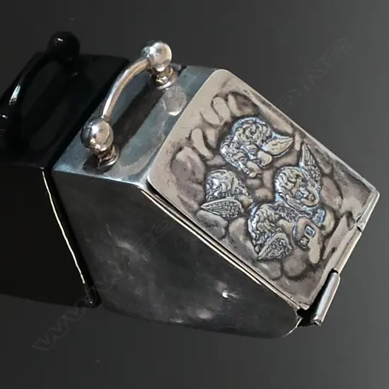 Miniature Silver Coal Scuttle Stamp Box, the lid embossed with angelic cherubs