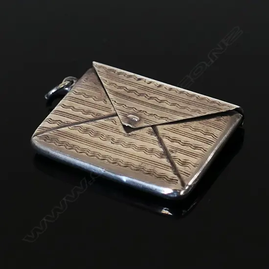 Marked “STERLING SILVER” Single Compartment Stamp Envelope.