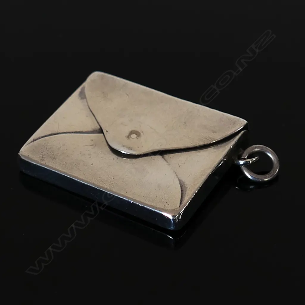Marked “Sterling Silver”  (by the clip hole) Single Compartment Stamp Envelope. Image 1++