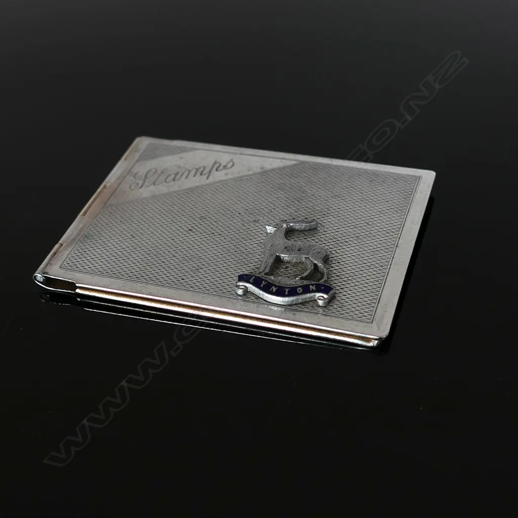 Chromium Plated Stamp Case marked “Stamps and “Stag” Logo Badge “LYNTON” Image 1++