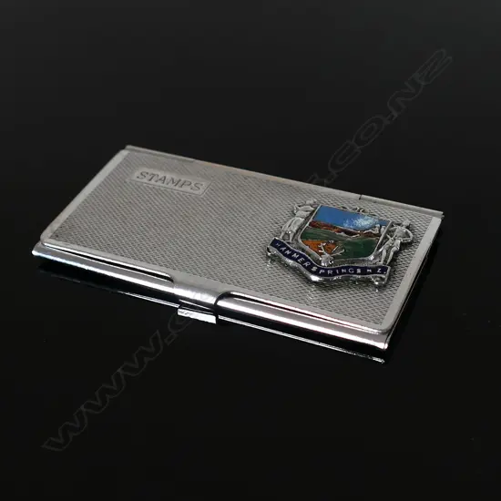 Chromium Plated Three Compartment Stamp Case marked “Stamps and enamel and Silver Logo badge “HANMER SPRINGS NZ”