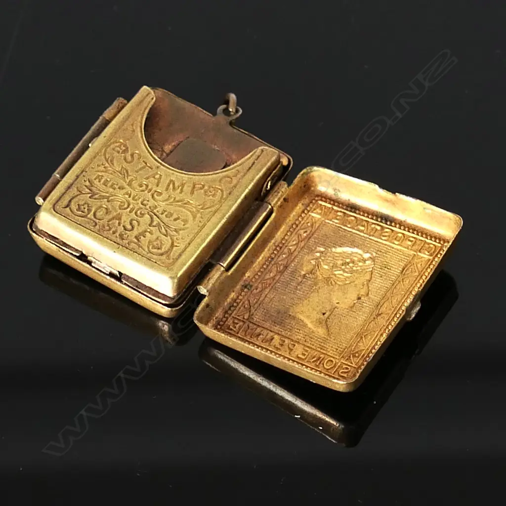 Brass Double Stamp Case, opens on both sides .Hinged leaves, finely embossed with Queen Victoria GB Postage stamps Image 1++