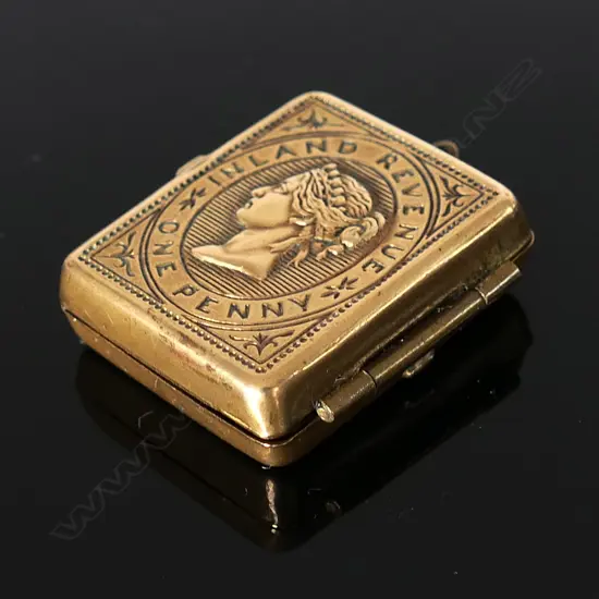 Brass Double Stamp Case, opens on both sides .Hinged leaves, finely embossed with Queen Victoria GB Postage stamps