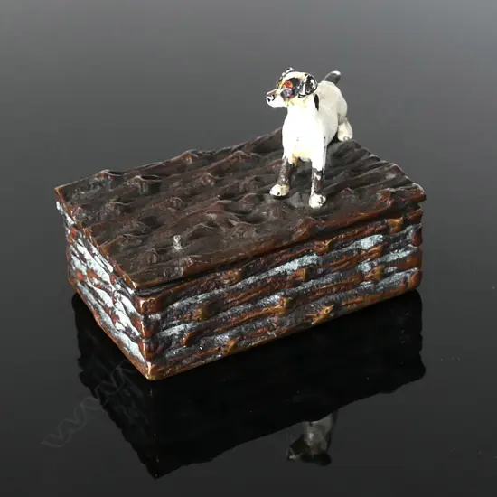 Brass Novelty Single Stamp Box, with naturalistic log surfaces surmounted by a painted  small terrier dog affixed to the top hinged lid.