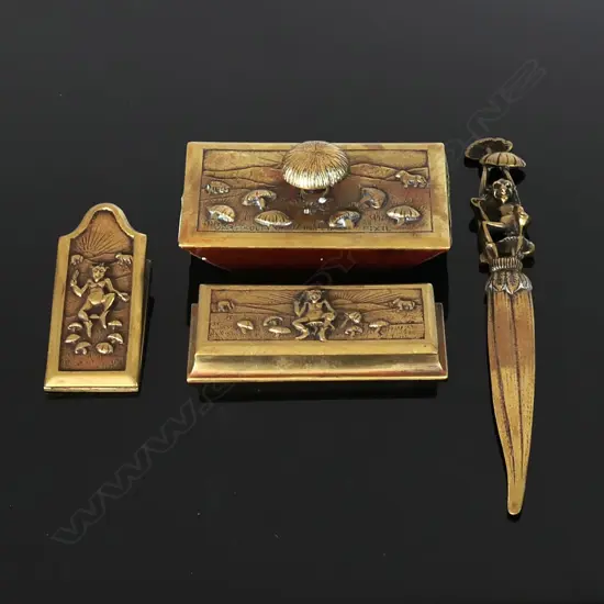 A suite of brass “Dartmoor Pixies” desk accessories