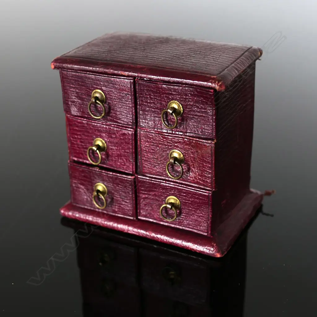 Maroon Leather Chest of Drawers, providing a Six-Postage Stamp Compartment Image 1++