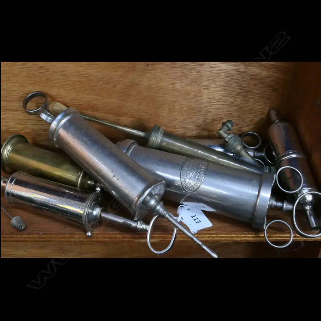 7 VARIOUS SYRINGES, (BRASS, NICKEL & CHROME) LGE BRASS ONE LABELLED 'MAYER MELTZER MAKERS LONDON' w WARRENT COAT-OF ARMS Image 1++