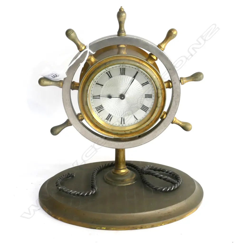 BRASS & SILVER PLATE SHIP'S WHEEL DESK CLOCK. MARKED: R&Co PARIS. SILVERED GUILLOCHE DIAL. (2 SPOKES ABSENT) H.280mm Image 1++