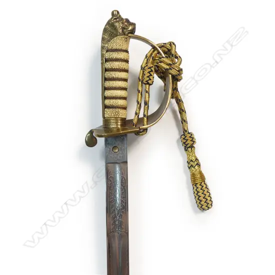 1827 Patt. British Naval Officers Sword by Henry Wilkinson, London, c.1901. 31 ½" slightly curved, flat-back spear-point blade with profuse engraving.