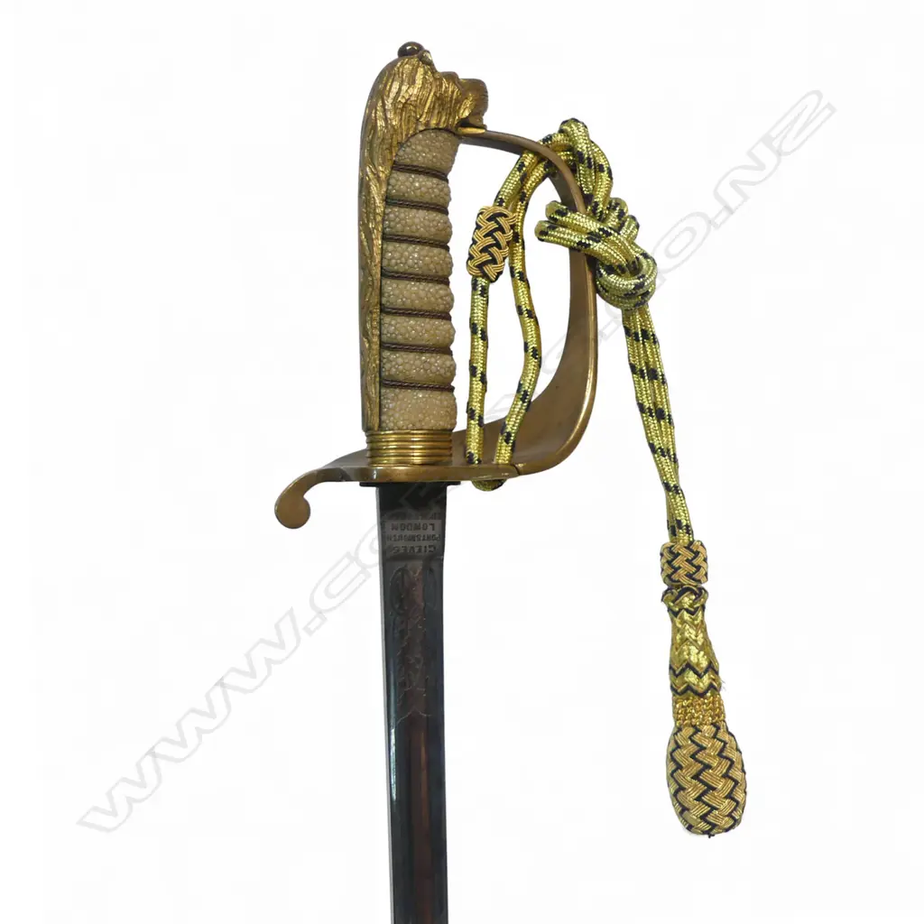 Royal Naval Reserve 1827 Pattern Officers Sword, 32 ½" narrow flat-back blade etched on the ricasso 'Gieves, Portsmouth, London, Edinburgh & Devonport'. Inset proof disc 'P'. Image 1++