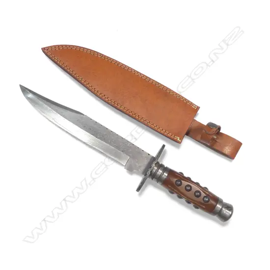 Very Large Bowie Knife with 10" Damascus clip-point blade and Damascus fittings to the swollen cylindrical wooden handle,