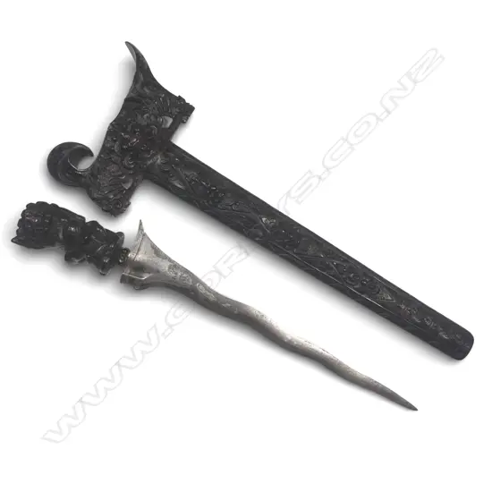 Indonesian Kris (Balinese) with demon carved wooden hilt, the ferrule set with glass beads,