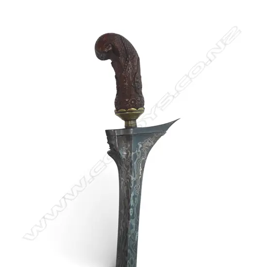 Kris with embossed brass bound scabbard with polished wood sarong,