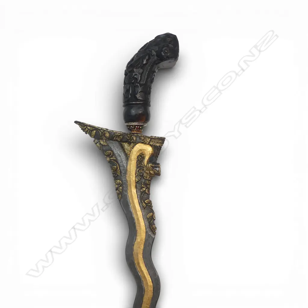 Indonesian Kris. (Balinese) with highly decorated 14½"wavy blade. The 13 luk blade decorated with the gilded tail of a naga whose head is carved at the ricasso. Image 1++