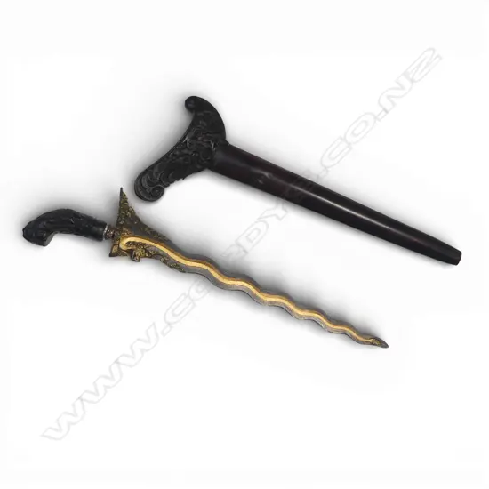 Indonesian Kris. (Balinese) with highly decorated 14½"wavy blade. The 13 luk blade decorated with the gilded tail of a naga whose head is carved at the ricasso.