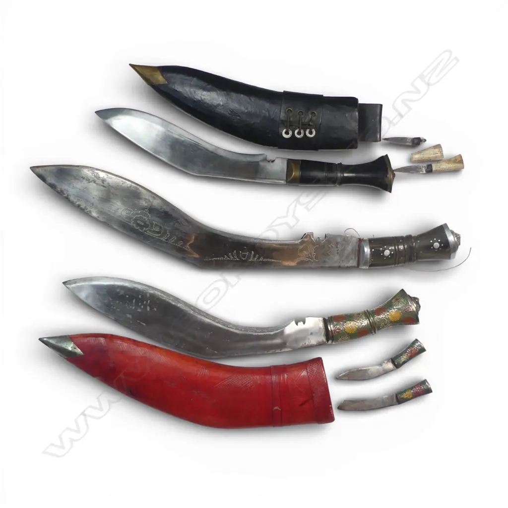 Three Nepalese/Indian Khukri. Two with scabbards, one Nepalese Army pattern (damaged small knife). Longest 490mm Image 1++