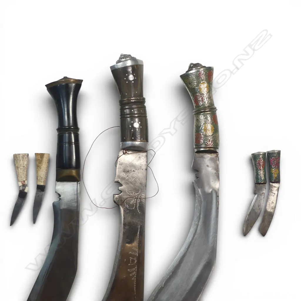 Three Nepalese/Indian Khukri. Two with scabbards, one Nepalese Army pattern (damaged small knife). Longest 490mm Image 1++
