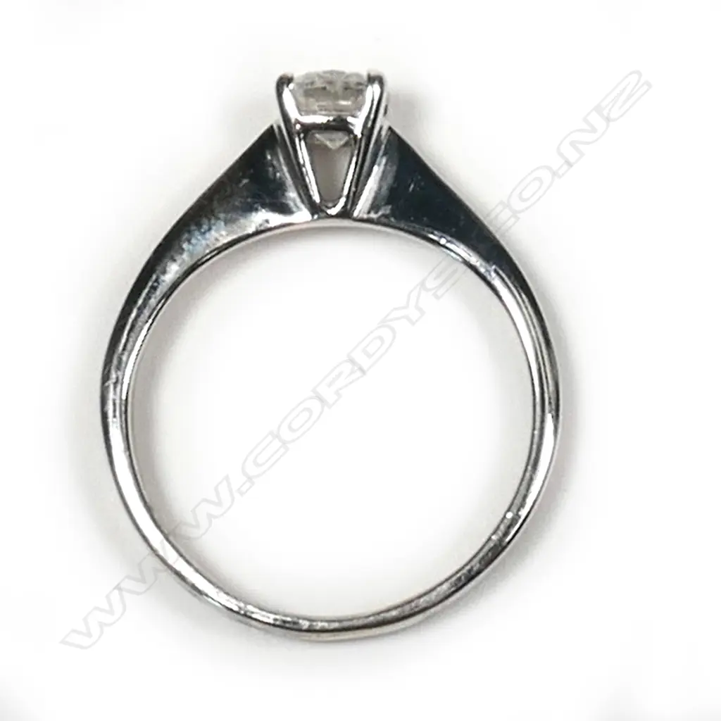 An 18ct white gold and diamond solitaire ring  0.35ct modern round brilliant cut diamond (Colour H, Clarity I1) claw set in a plain tapering shank, upswept shoulders. Valuation available. Image 1++