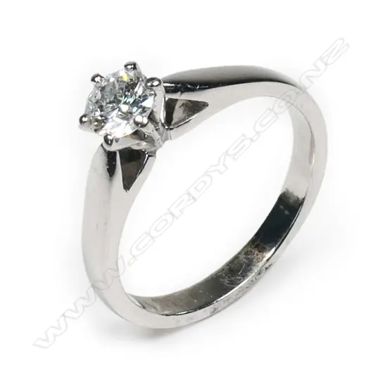 An 18ct white gold and diamond solitaire ring,