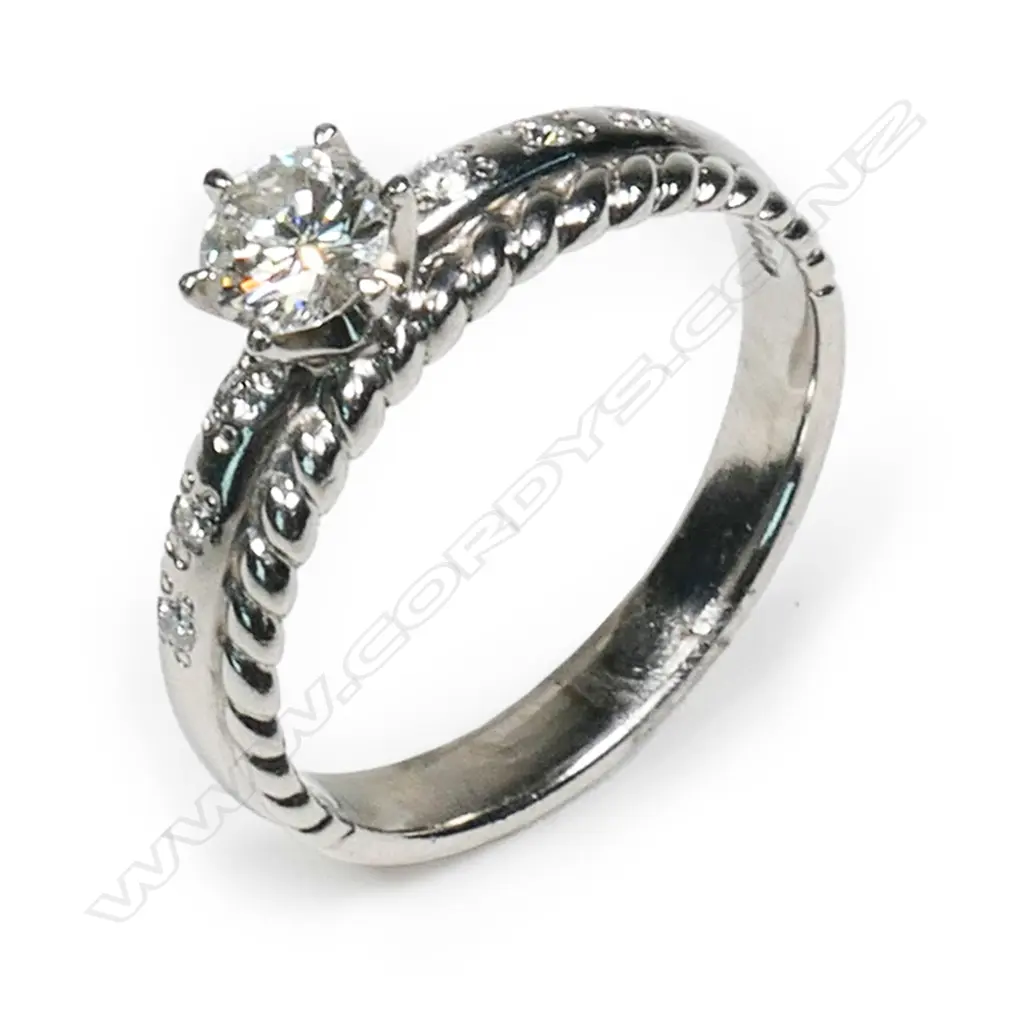 A platinum and diamond ring, Image 1++