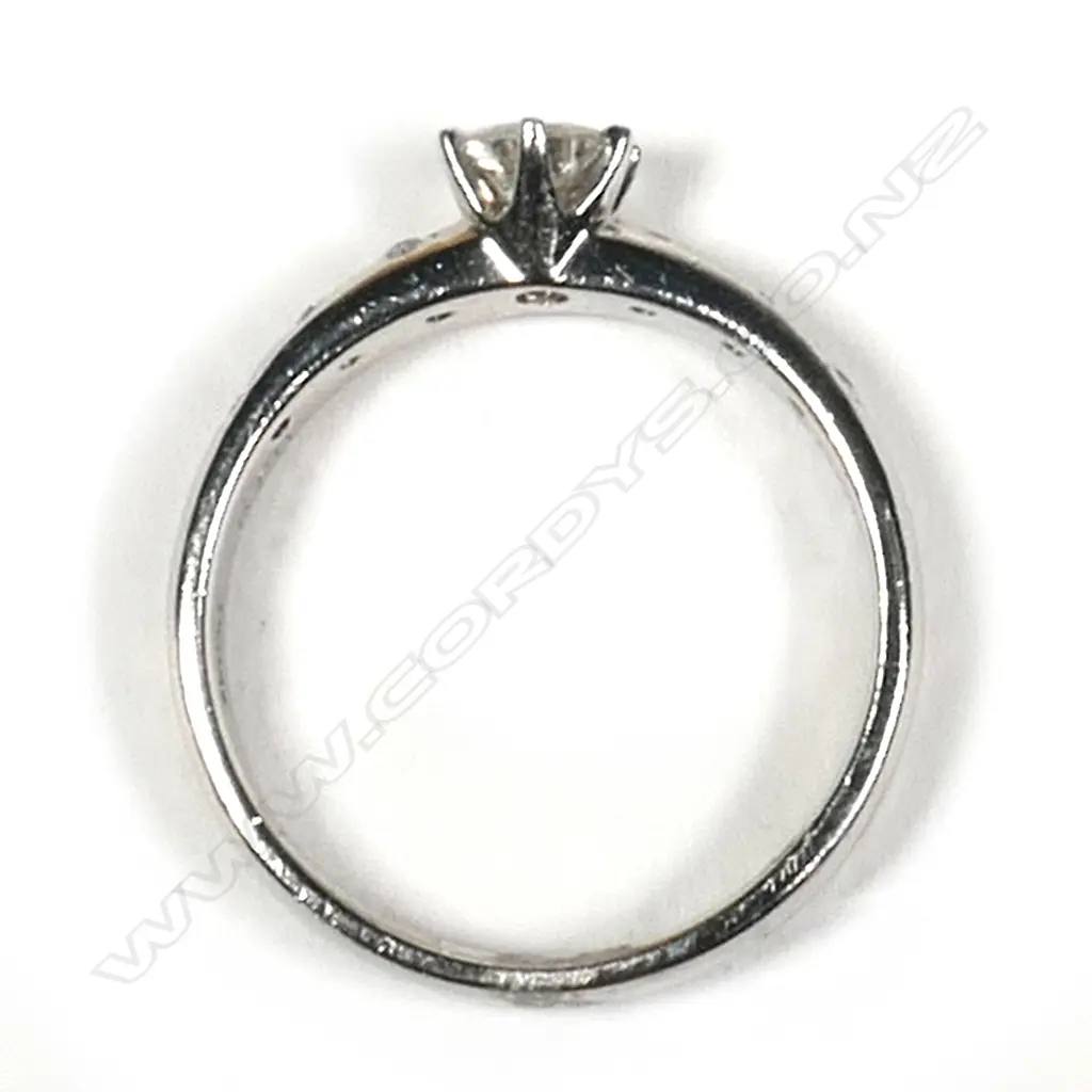 A platinum and diamond ring, Image 1++