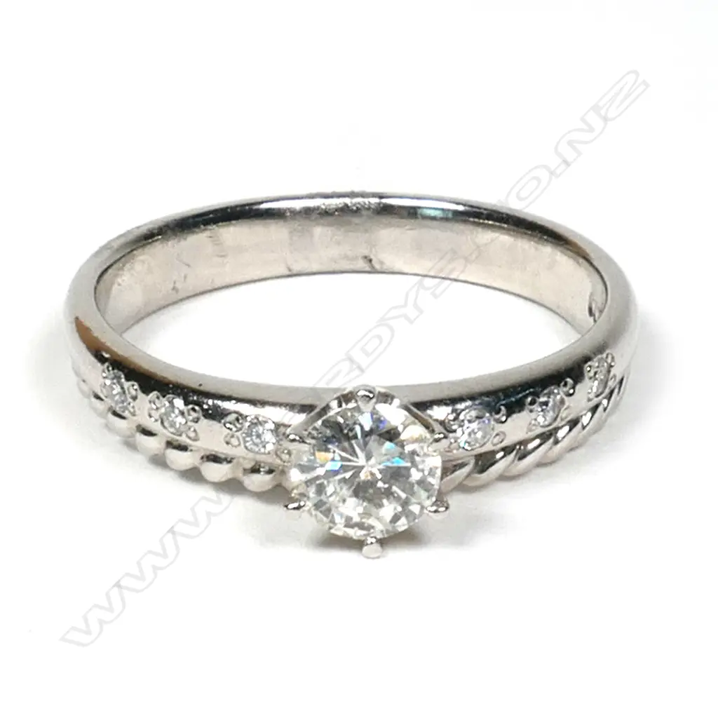 A platinum and diamond ring, Image 1++