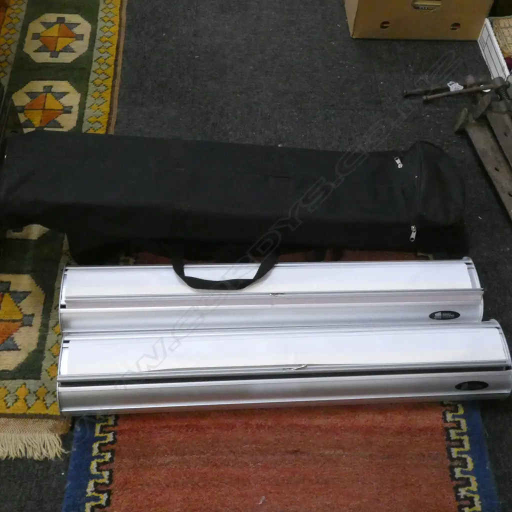 2 PROMOTIONAL BANNERS IN BLACK BAGS Image 1++