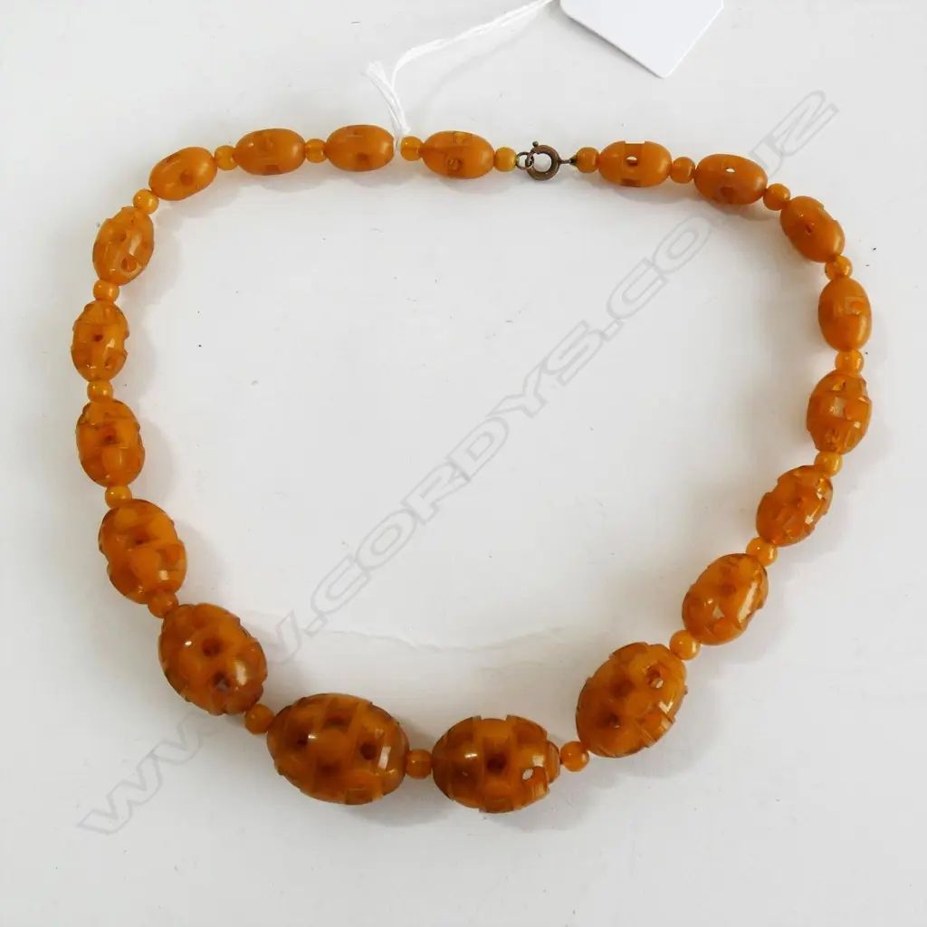 AMBER/PLASTIC ? CARVED BEAD NECKLACE Image 1++