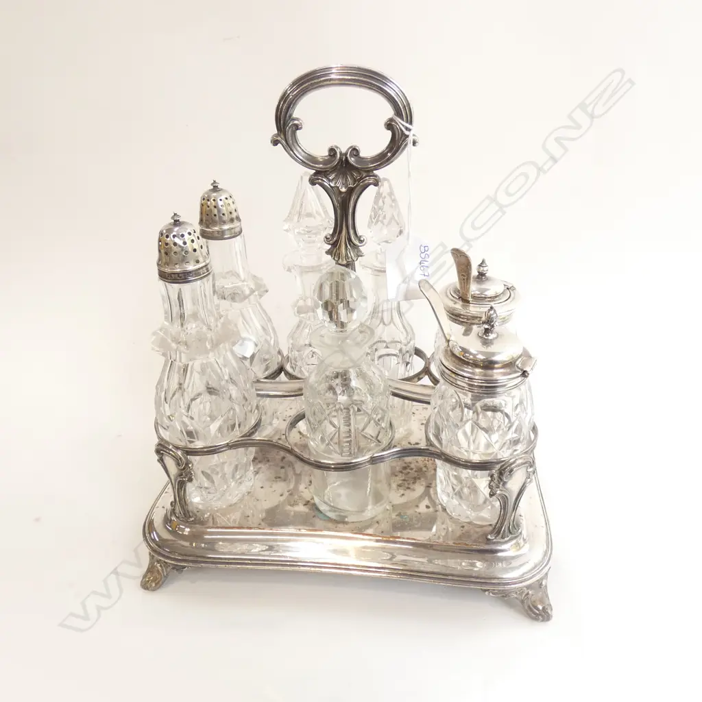 8 PCE SILVER PLATE & GLASS CRUET SET; SILVER PLATE STAND + 7 CONTAINERS Image 1++