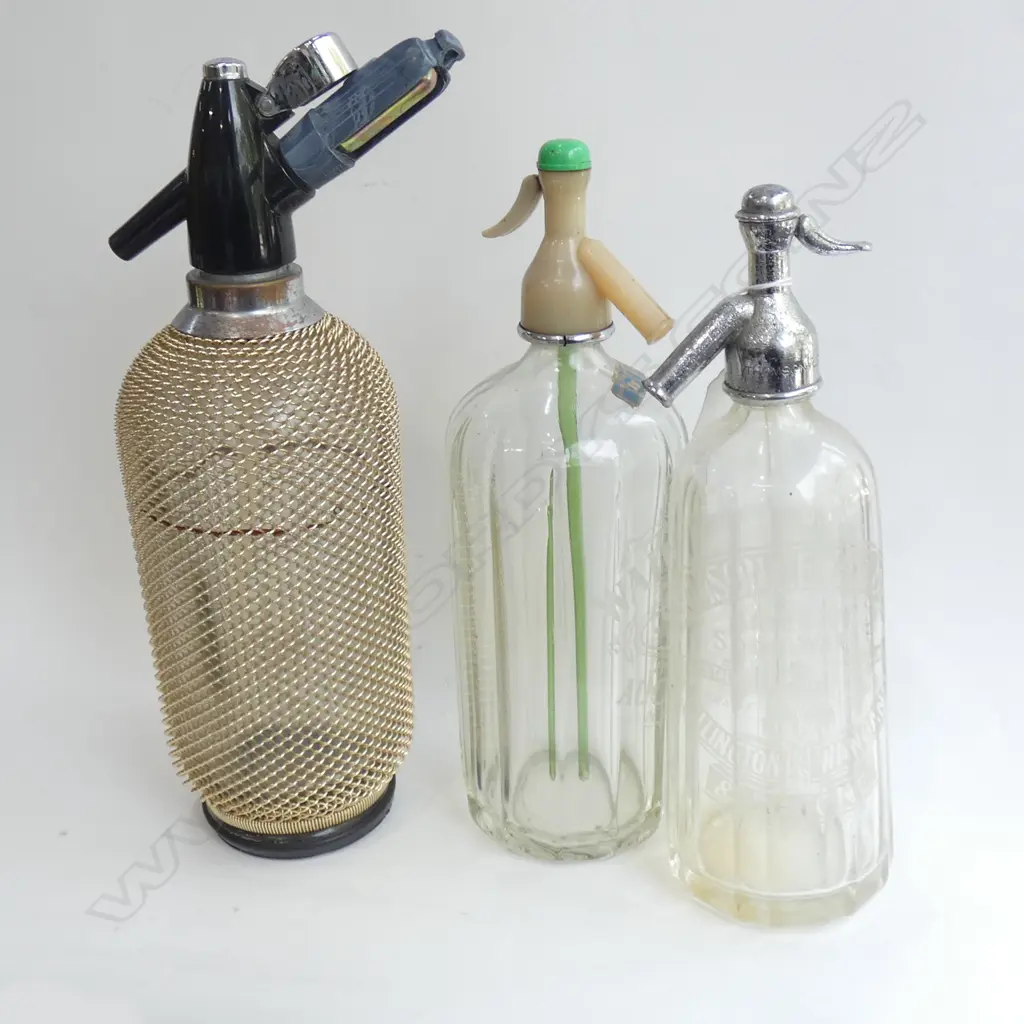3 VINTAGE SODA SYPHON BOTTLES; 1 WITH MESH COVER (LARGEST H 380MM Image 1++