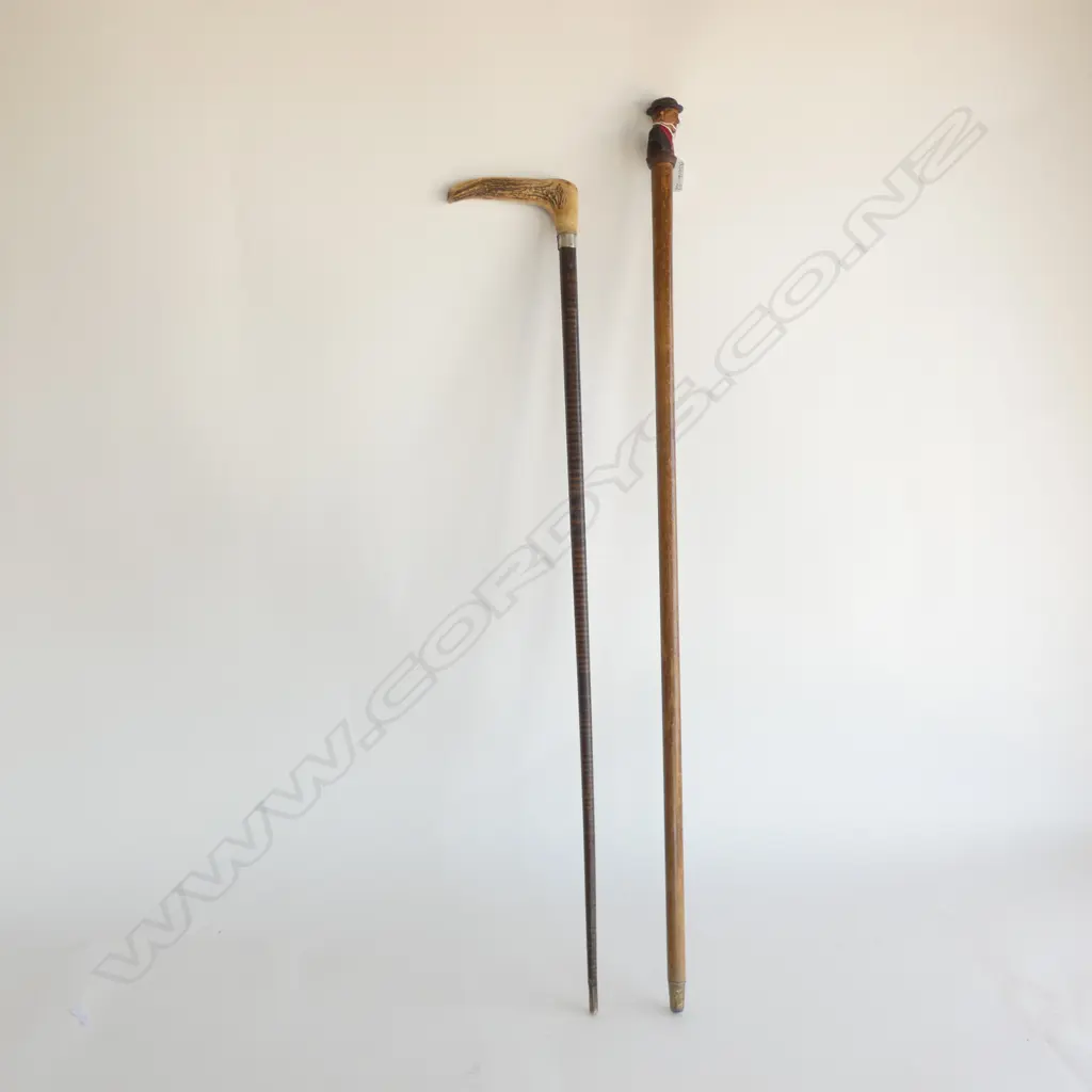 2 WALKING STICKS; 1 CARVED WOODEN HANDLE & 1 DEER ANTLER HANDLE w LEATHER CANE Image 1++