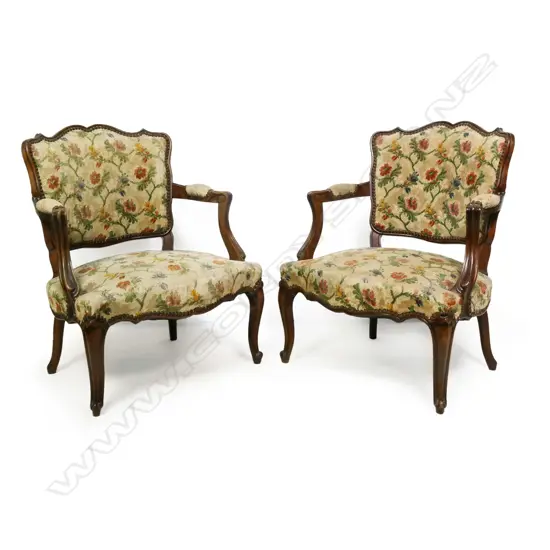 A pair of French walnut open elbow armchairs scrolling frame original floral and cream upholstery with upholstery nail details. 600 x 400 x 750mm.