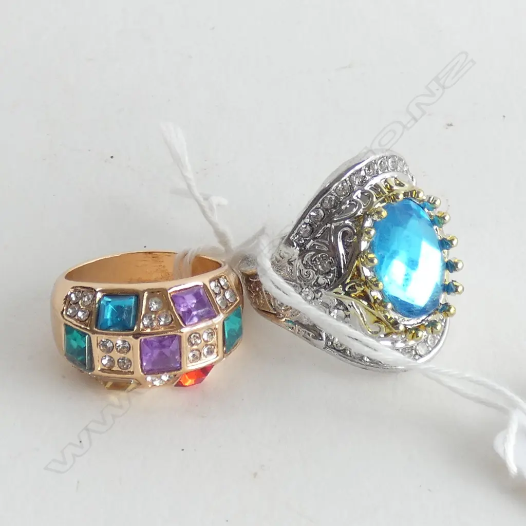 2 RINGS. 1X SILVER & BLUE ZIRCON. 1X GILT MULTI GEM Image 1++
