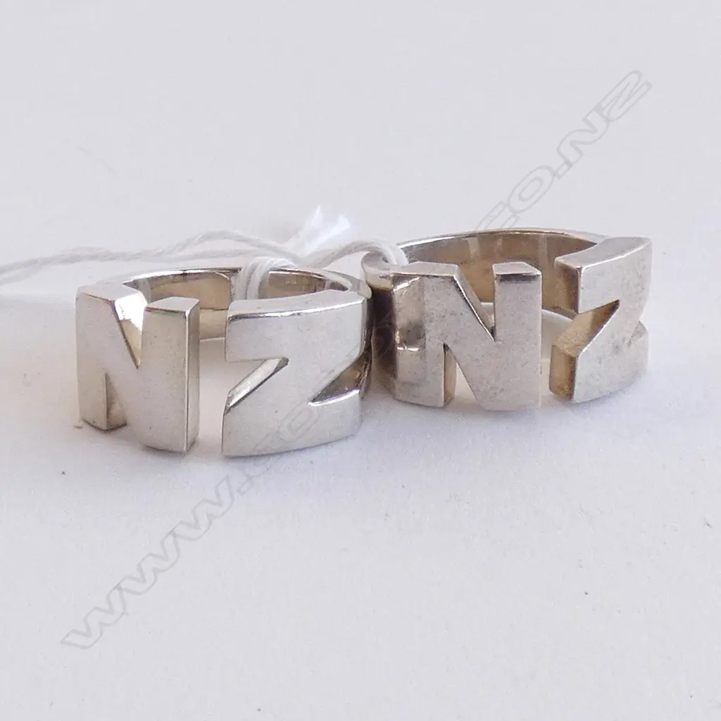 TWO SILVER 'NZ' RINGS Image 1++