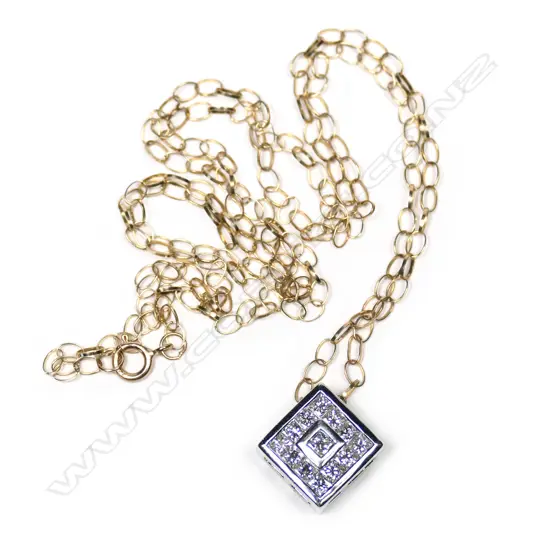 An 18ct white gold and diamond pendant