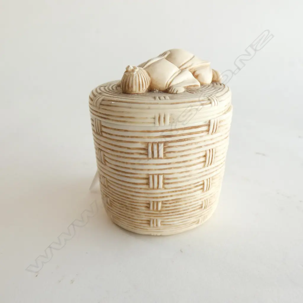 JAPANESE IVORY OKIMONO OF A MAN PEERING THROUGH THE LID OF A WOVEN BASKET Image 1++