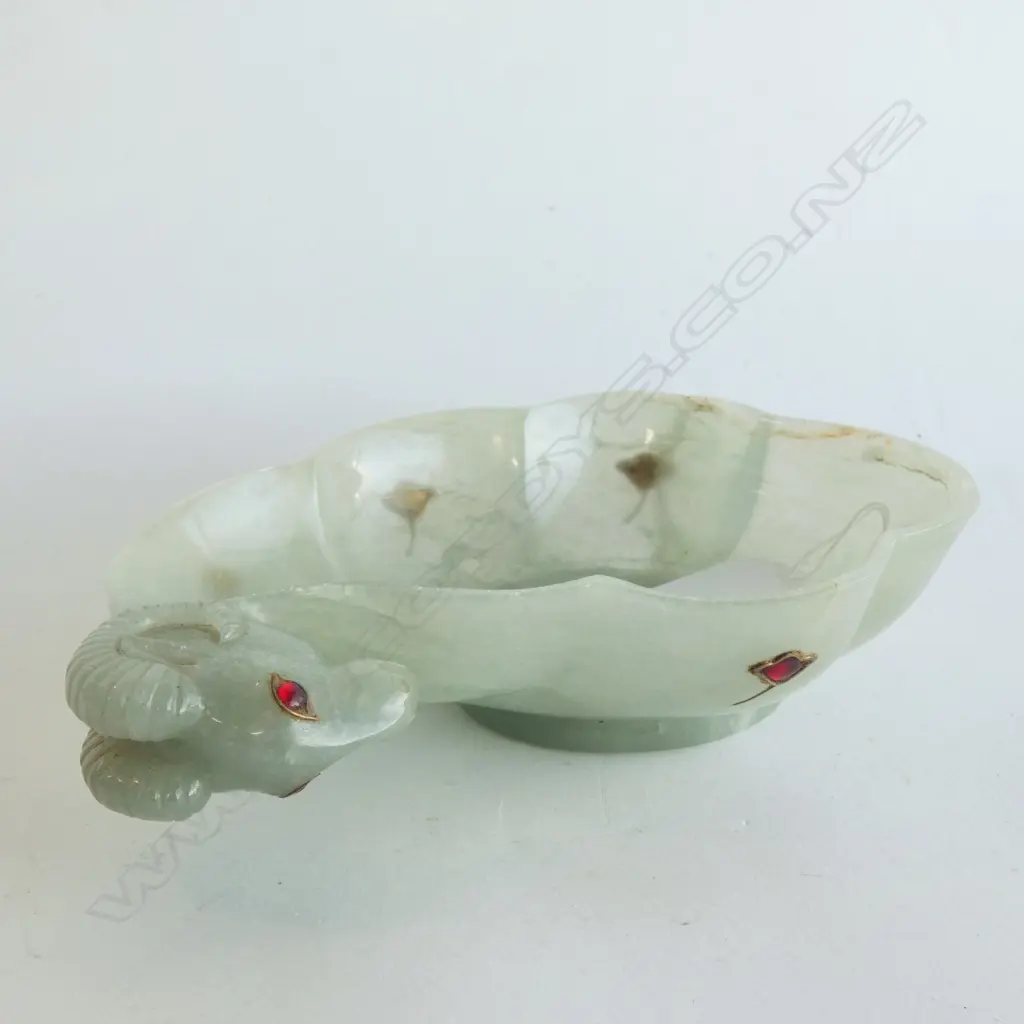 MUGHAL-STYLE RAM'S HEAD BOWL, POSSIBLY GLASS INSET WITH RED ENAMEL CABACHONS. LENGTH 180mm. Image 1++