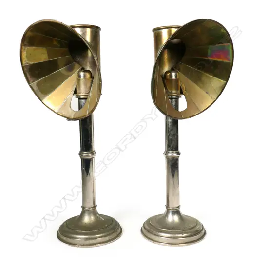 A pair of silver-plated copper and brass 19thC spring-loaded candlesticks