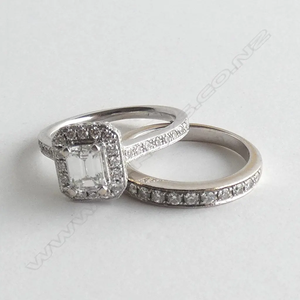 18CT WHITE GOLD AND DIAMOND CLUSTER RING 0.40ct emerald cut & DIAMOND SET BAND (valuation) Image 1++