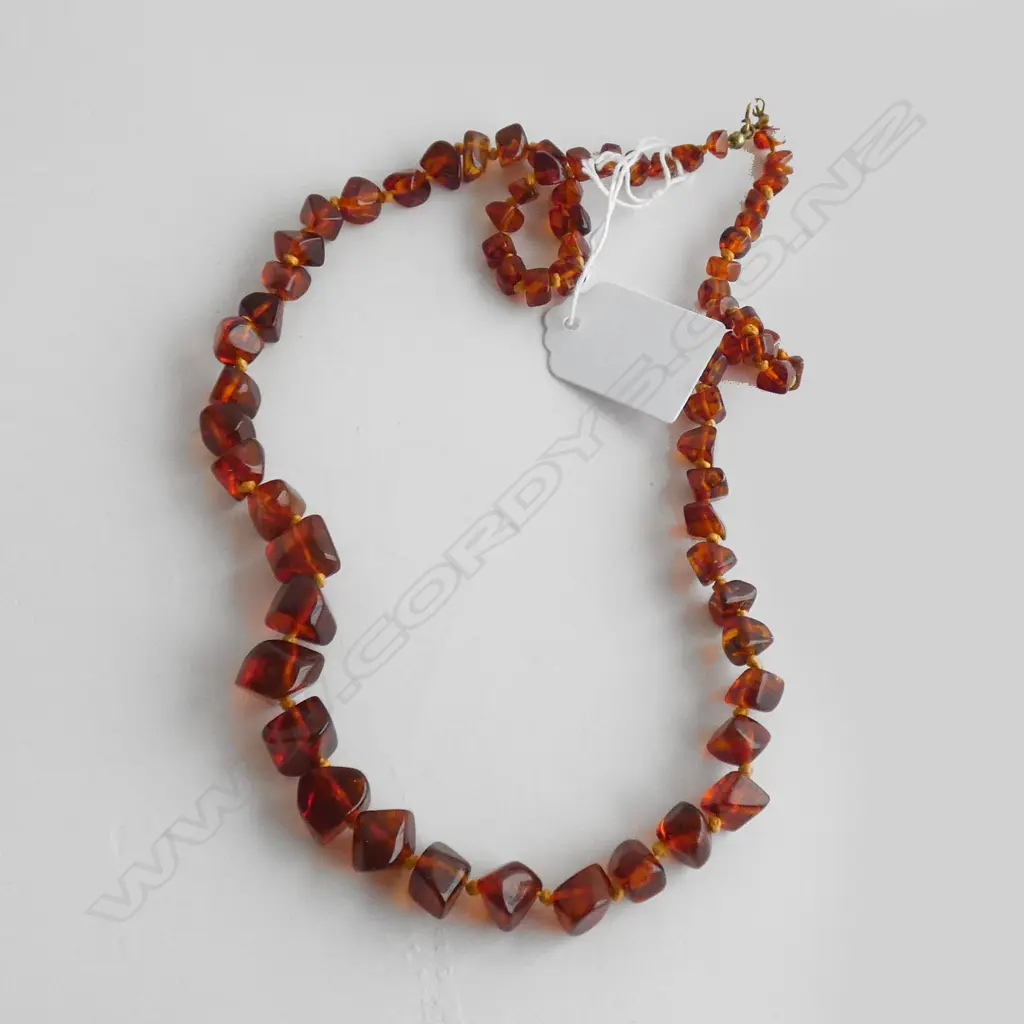 (20175)AMBER GRADUATING POLISHED NUGGET NECKLACE L.600mm Image 1++