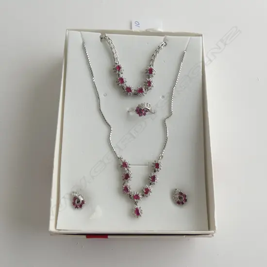 SILVER AND RUBY SUITE OF JEWELLERY (certificate)