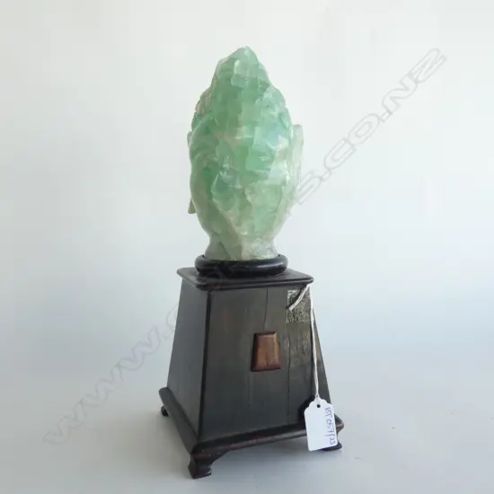 JADE-GREEN GLASS BUDDHA HEAD ON EBONISED STAND H.300mm