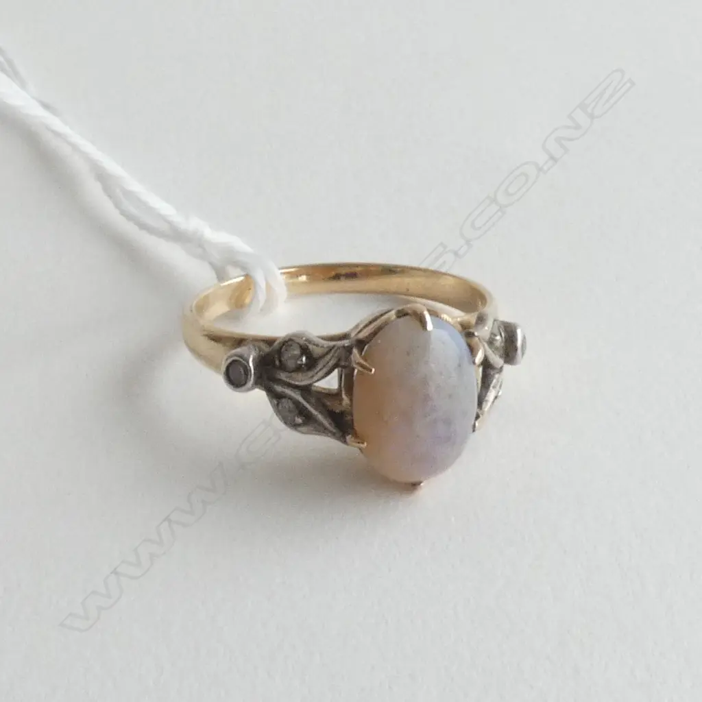 OPAL & DIAMOND SET RING IN UNMARKED 9CT GOLD Image 1++