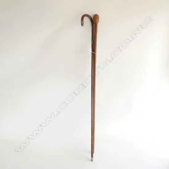 2 OLD WOODEN WALKING STICKS. 1 W SILVER MOUNTS