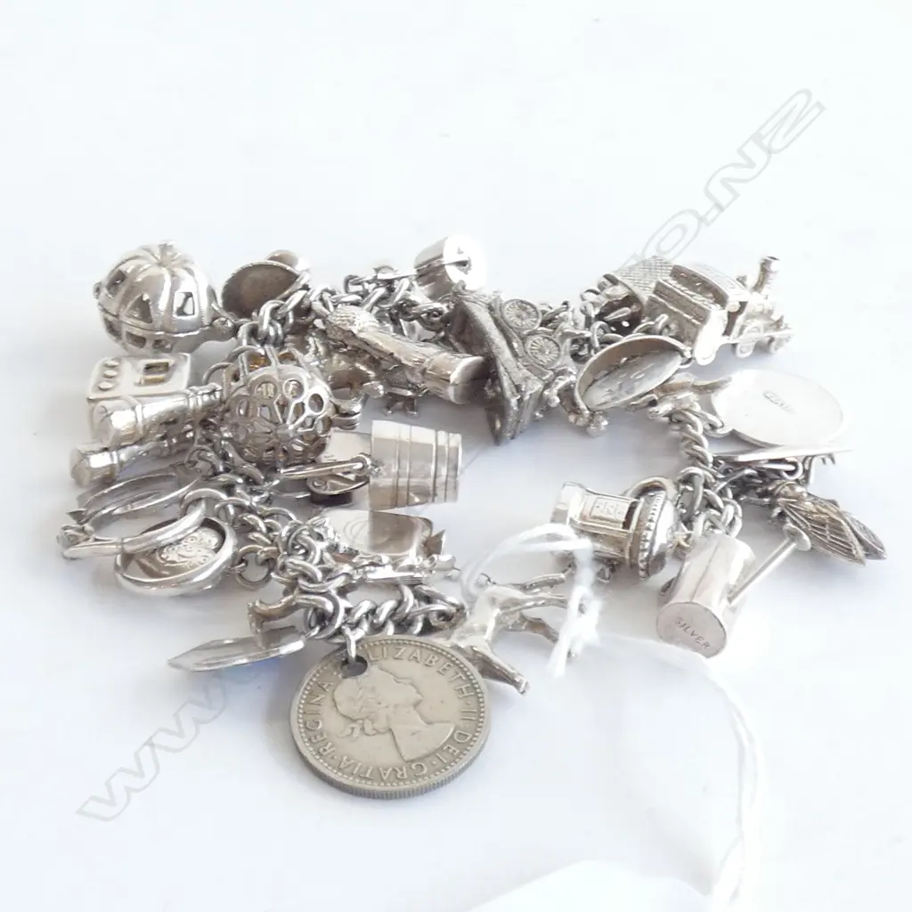 SILVER CHARM BRACELET - 35 CHARMS 70gms Image 1++