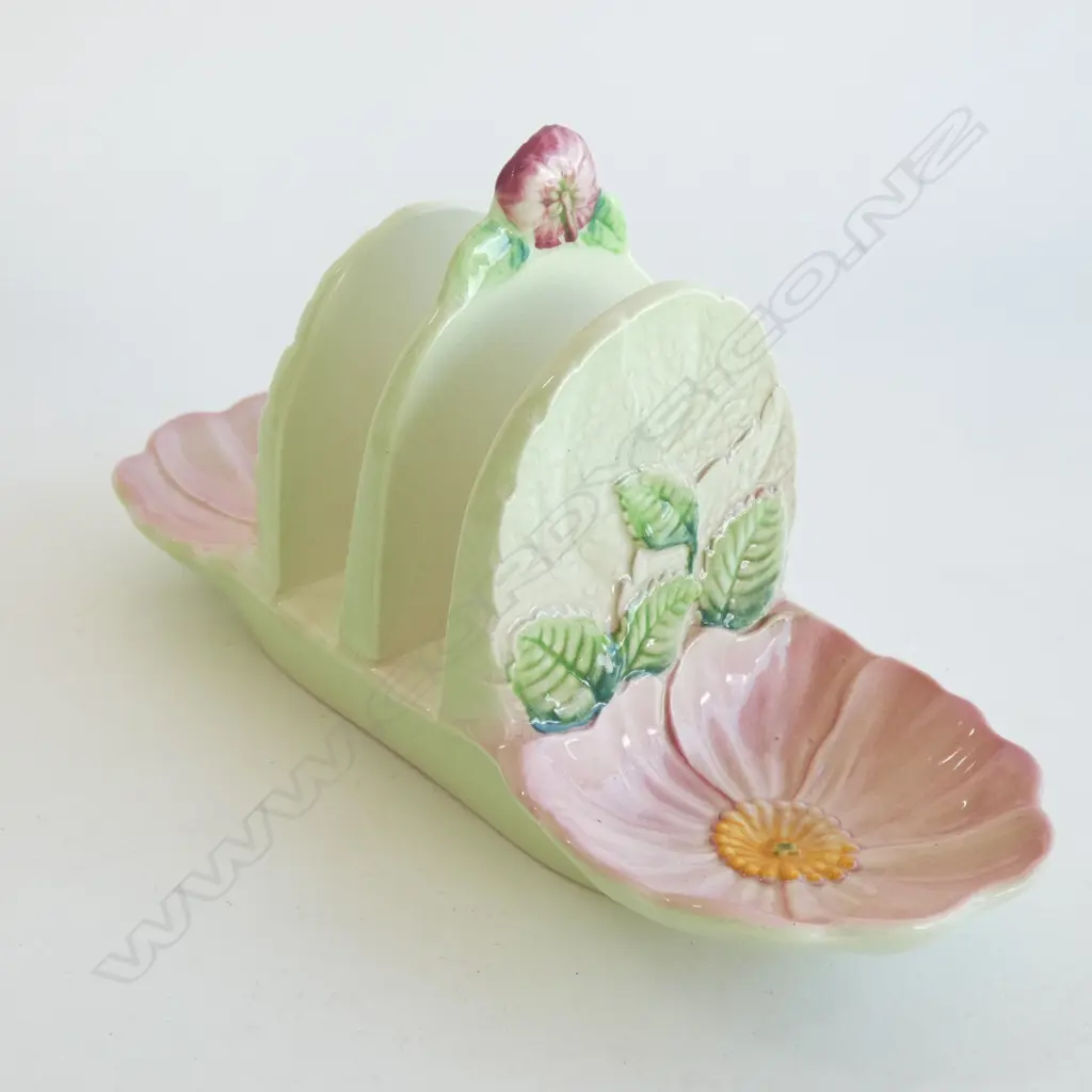A CARLTON WARE EMBOSSED TOAST RACK, PINK FLOWERS JAM HOLDERS AT EACH END Image 1++