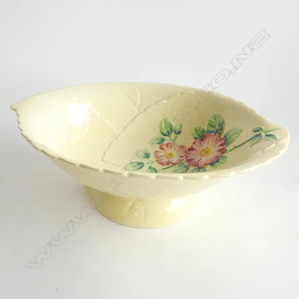 A CARLTON WARE EMBOSSED SALAD BOWL, YELLOW GROUND, WILD ROSE PATTERN. W.280mm… Image 1++