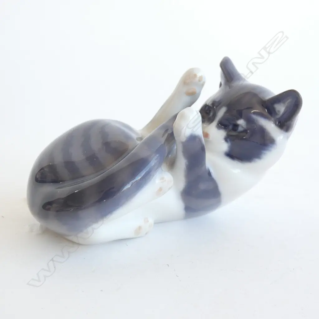A ROYAL COPENHAGEN CAT, LYING ON BACK, PLAYING WITH TAIL. L.100mm Image 1++