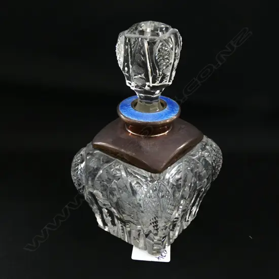 A PERFUME BOTTLE, CUT GLASS SILVER PLATE/ENAMEL STOPPER